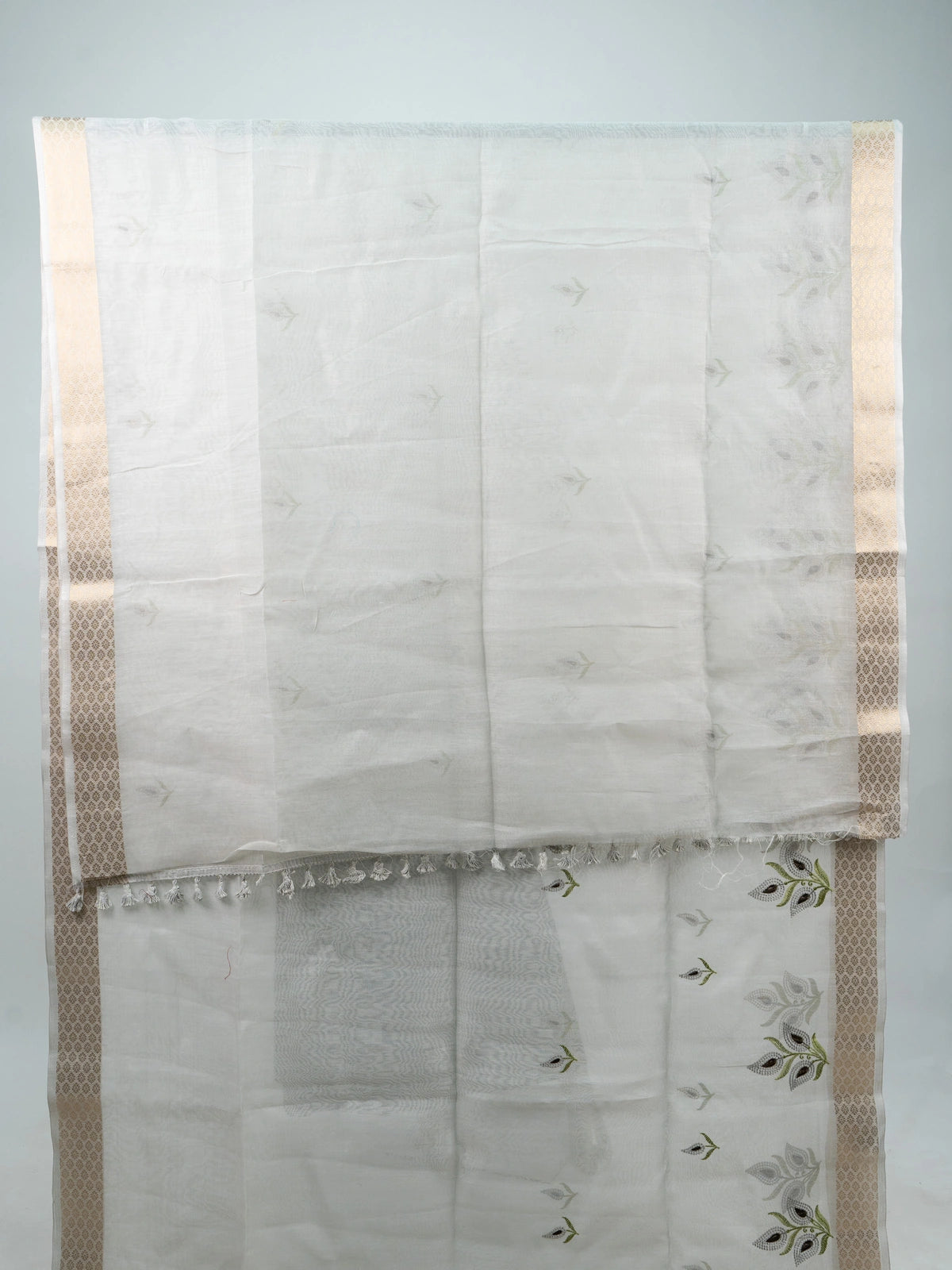 White linen cotton saree with gold zari border, embroidered leaf buttas and contrast black blouse