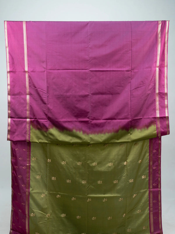 Mehndi green semi silk saree with magenta contrast border, gold zari buttas and woven pallu