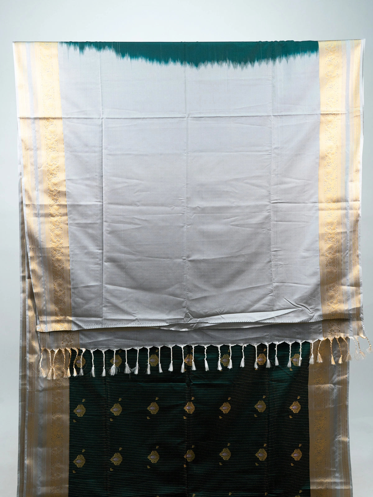 Bottle green Vaira Oosi Design semi silk saree with silver-gold zari border and contrast cream pallu