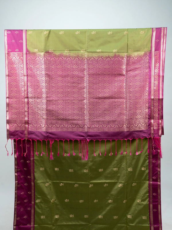 Mehndi green semi silk saree with magenta contrast border, gold zari buttas and woven pallu