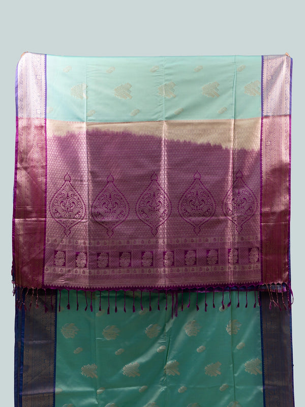 Turquoise and purple semi silk saree with silver zari border and paisley pallu