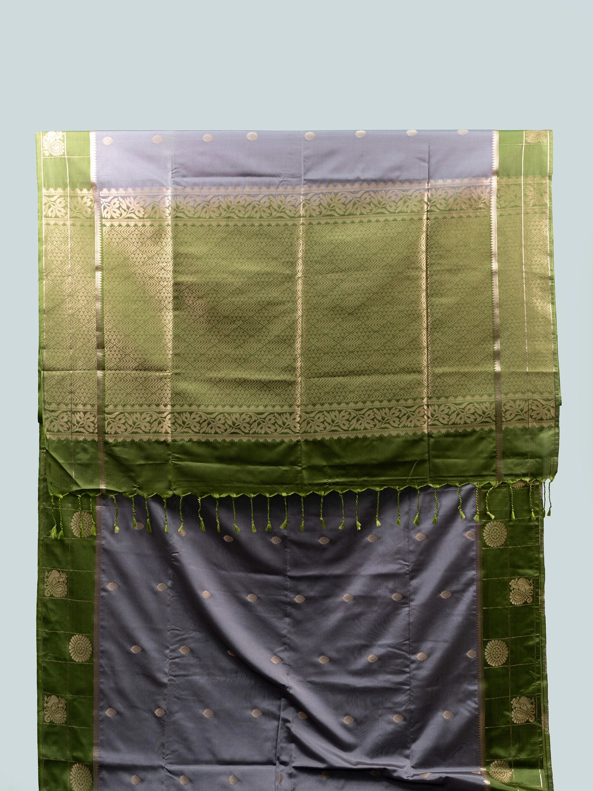 Grey semi silk saree with green contrast gold zari border and floral pallu