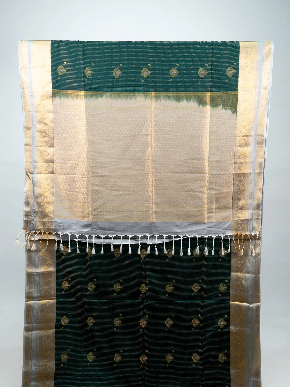 Bottle green Vaira Oosi Design semi silk saree with silver-gold zari border and contrast cream pallu