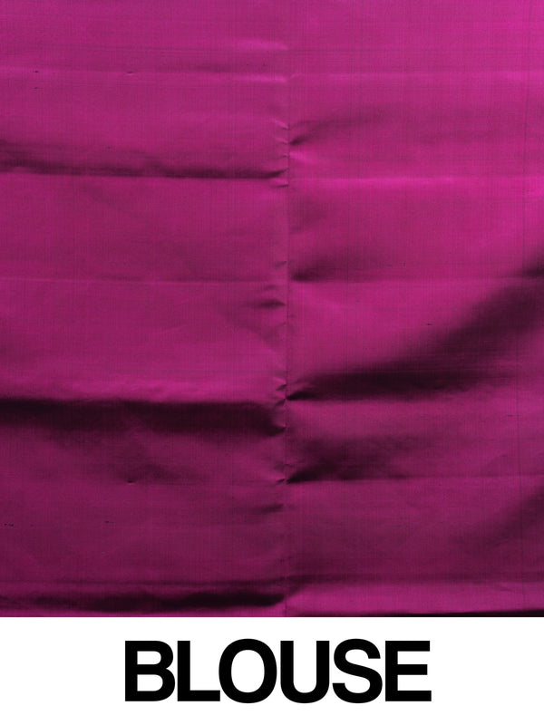 Teal green soft silk saree with ikat motifs, gold zari border and contrast magenta zari pallu