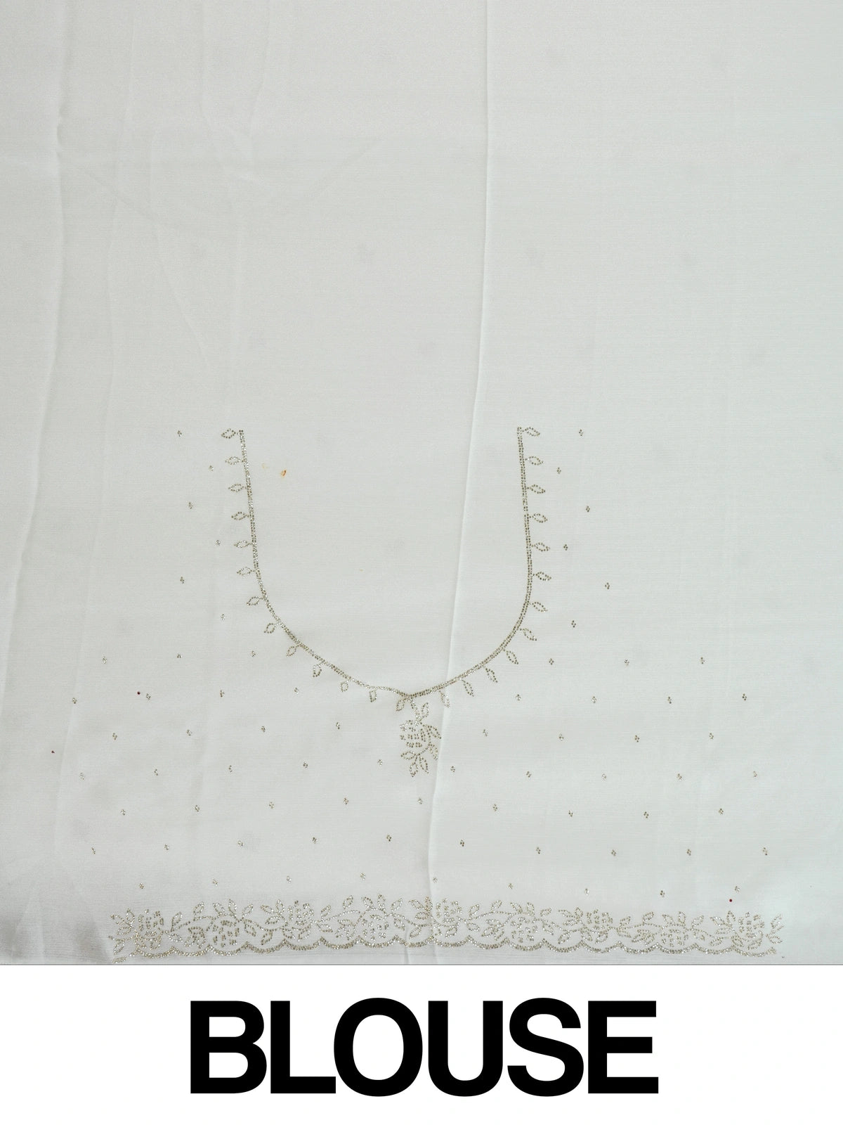 Off-white georgette designer saree with silver floral buttas and scalloped embellished border