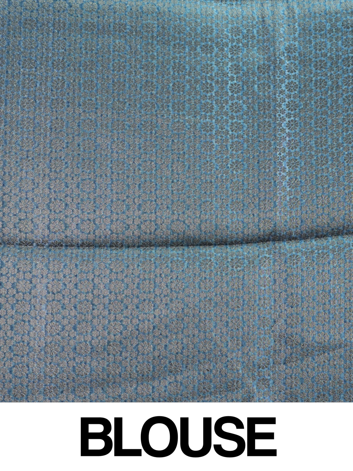 Teal blue semi tussar saree with pink floral print and contrast zari border