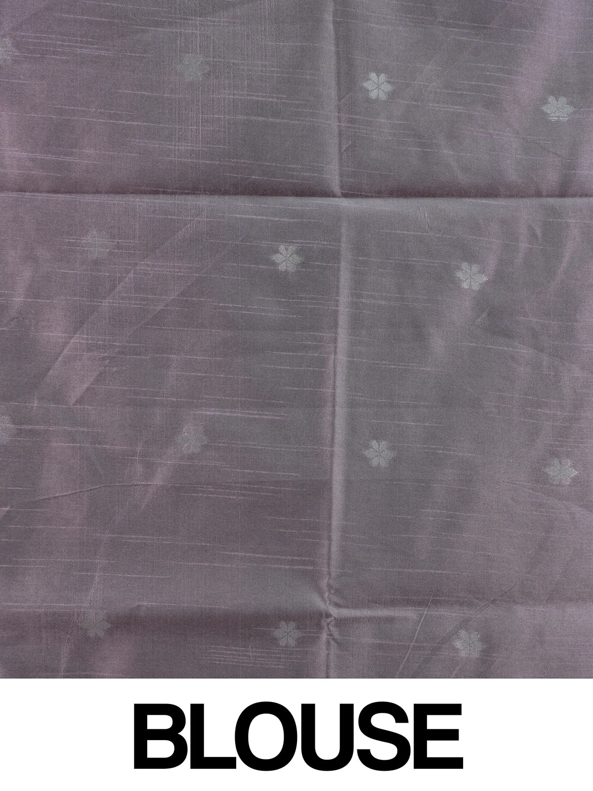 Dusty mauve semi tussar saree with silver zari floral pallu and geometric border