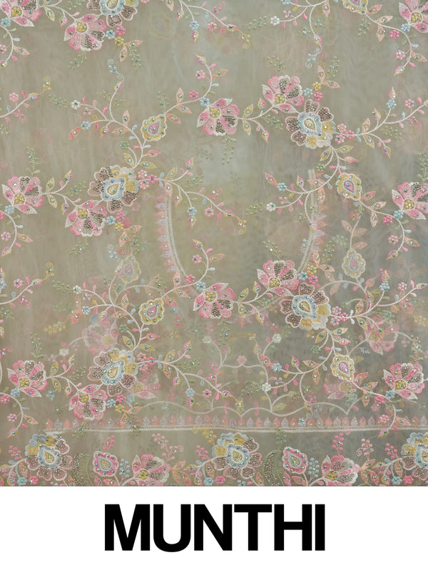 Cream net designer saree with pastel multicolour floral embroidery and scalloped border