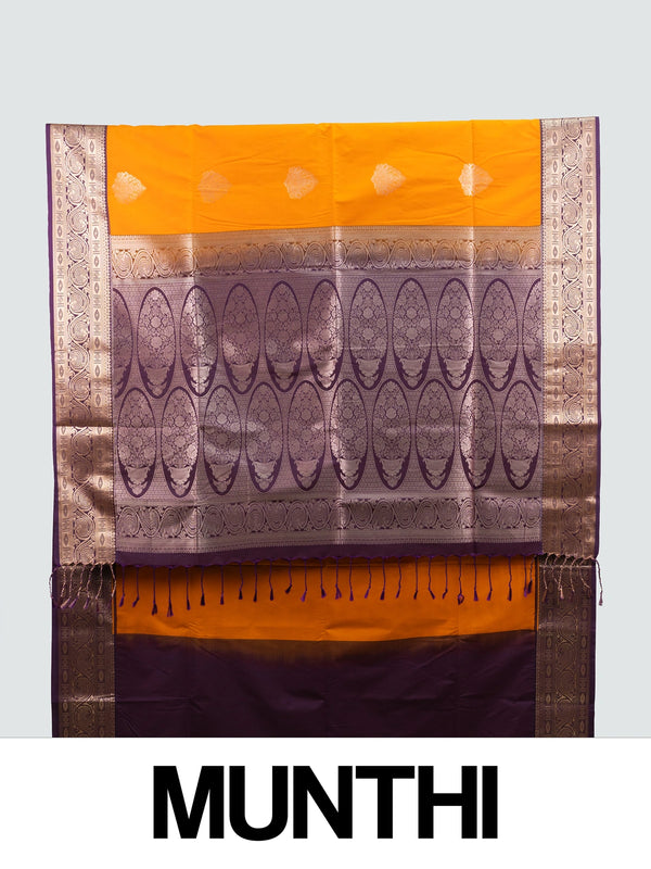 Mustard semi silk saree with contrast purple gold zari border, zari buttas, and ornate woven pallu