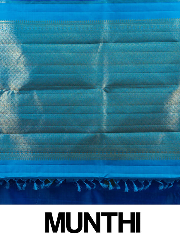 Royal blue pure Kanchipuram silk saree with turquoise and gold zari border and woven peacock motifs