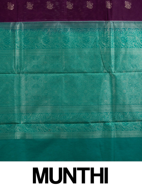 Purple silk cotton saree with teal-green contrast border and gold zari lotus motifs