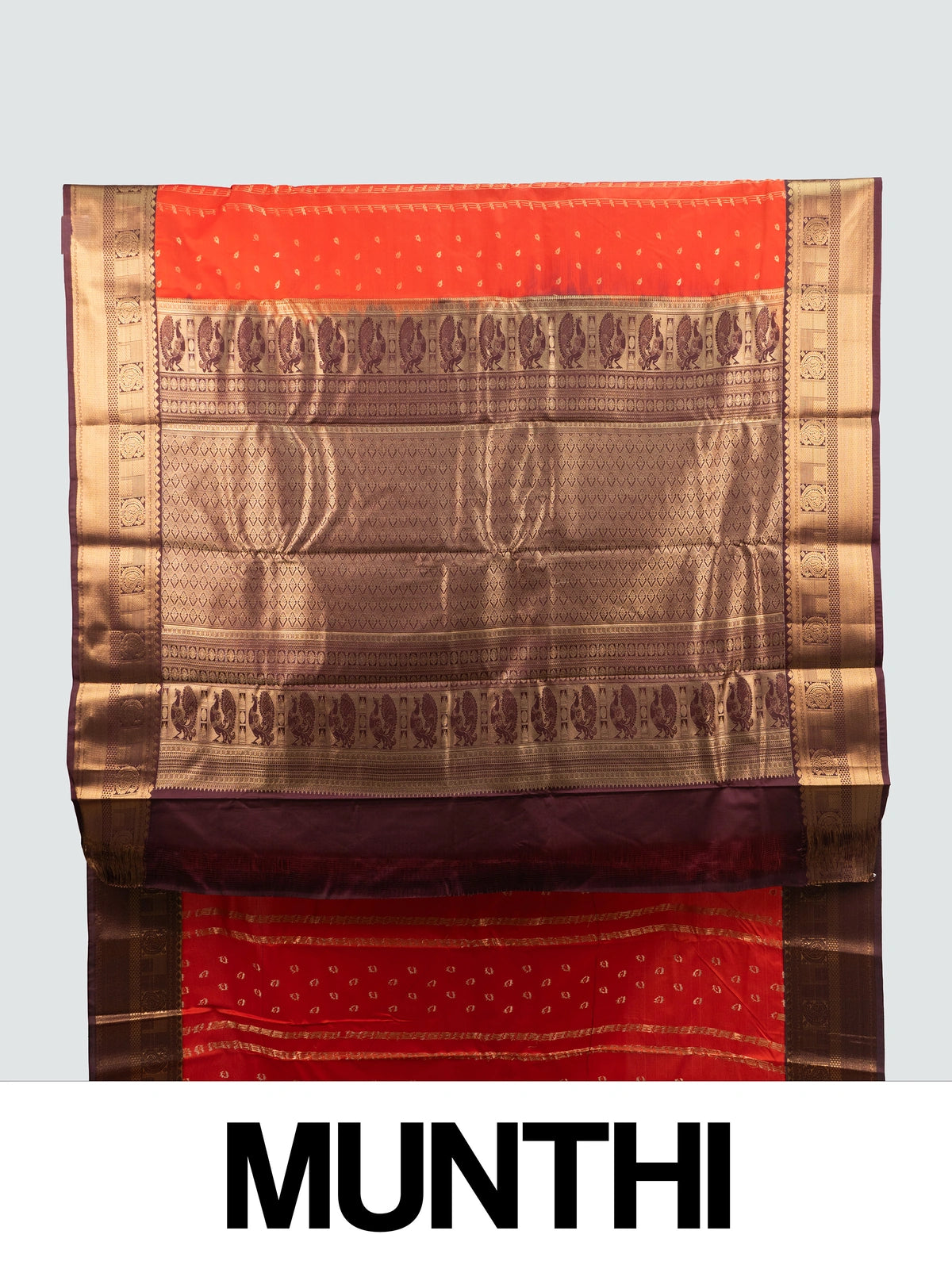 Orange semi silk saree with maroon contrast border and gold zari peacock pallu