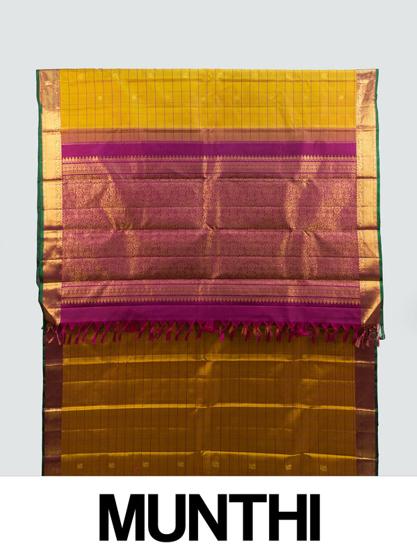 Mustard yellow pure Kanchipuram silk saree with checked body, gold zari buttas and contrast magenta zari border and pallu