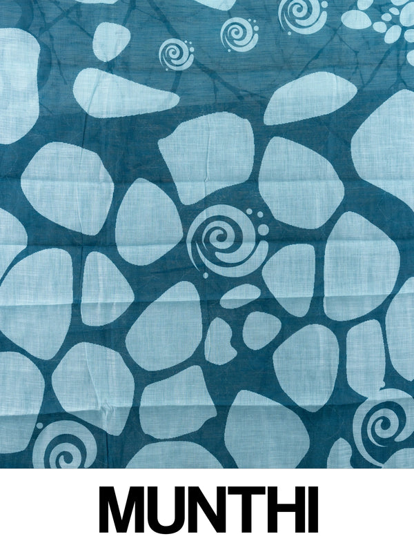 Sky blue and teal batik linen cotton saree with white pebble motifs and gold zari border