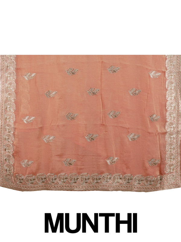 Peach shimmer tissue designer saree with embroidered leaf buttas and an ornate rose-gold border