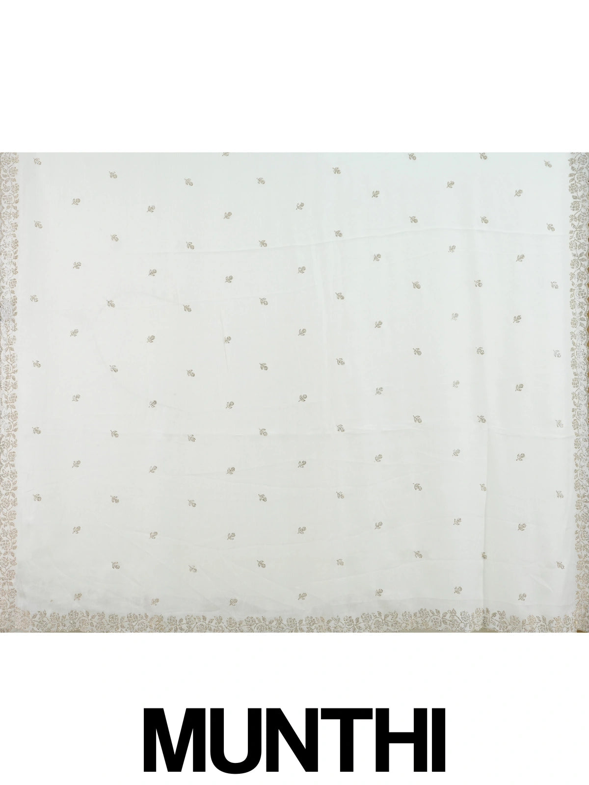 Off-white georgette designer saree with silver floral buttas and scalloped embellished border
