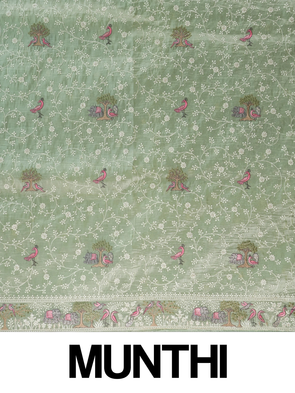 Sage green designer saree with white floral embroidery, pink bird and elephant motifs and pom-pom lace border
