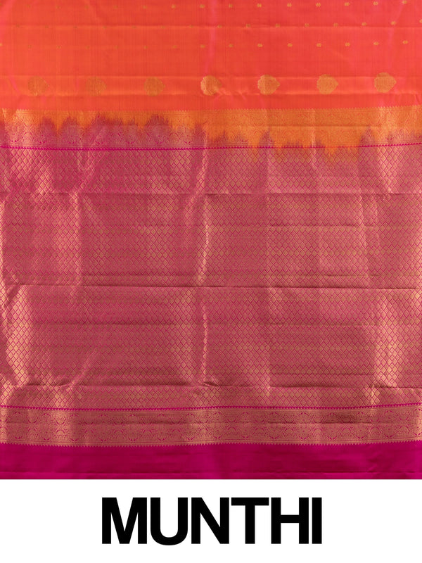Orange pure Kanchipuram silk saree with contrast pink zari border and gold buttas
