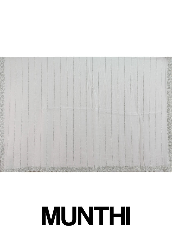 Light grey sheer designer saree with silver stone stripes and scalloped border, styled with a yellow embroidered blouse