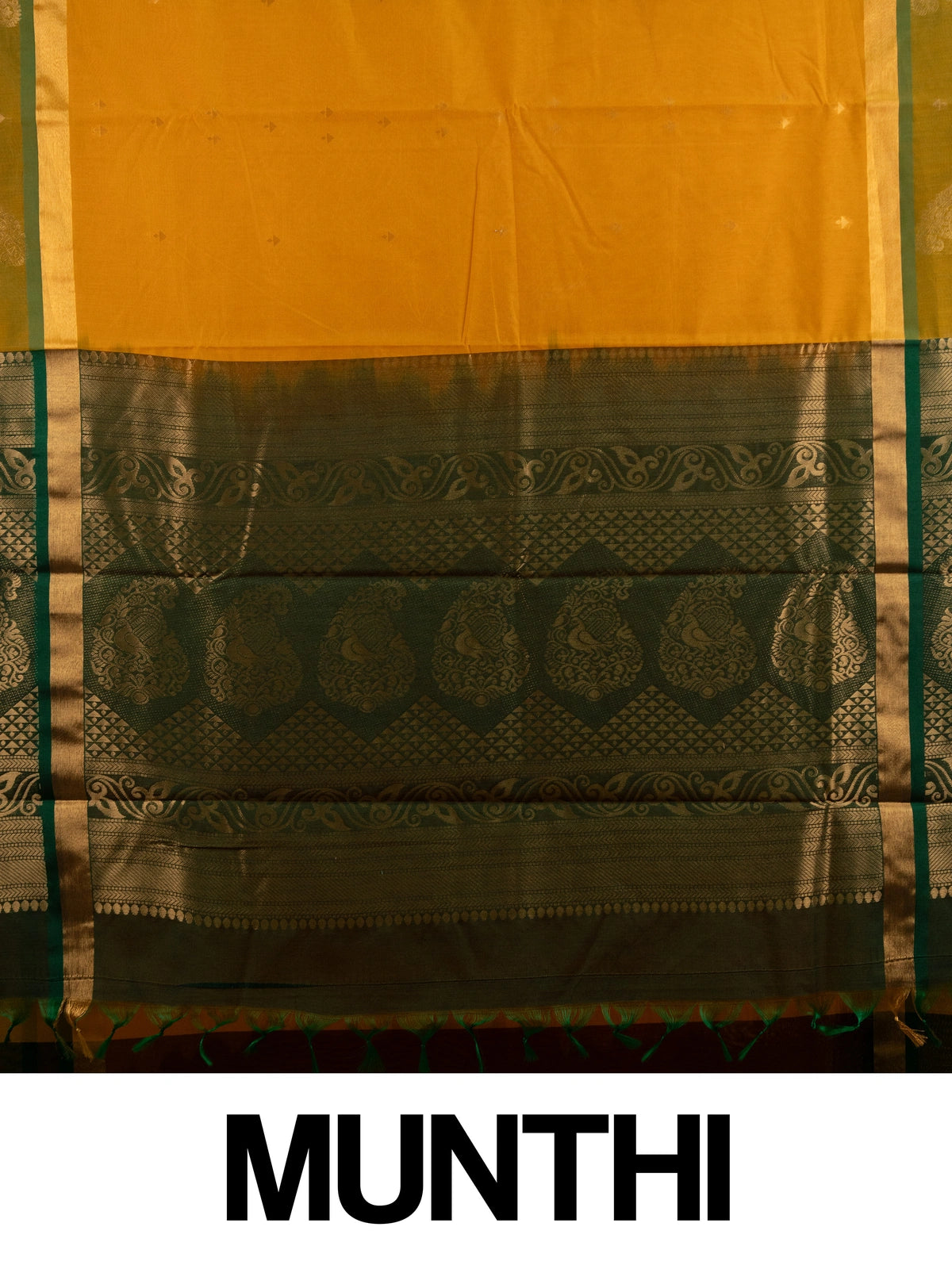 Mustard yellow silk cotton saree with green gold zari border and peacock pallu
