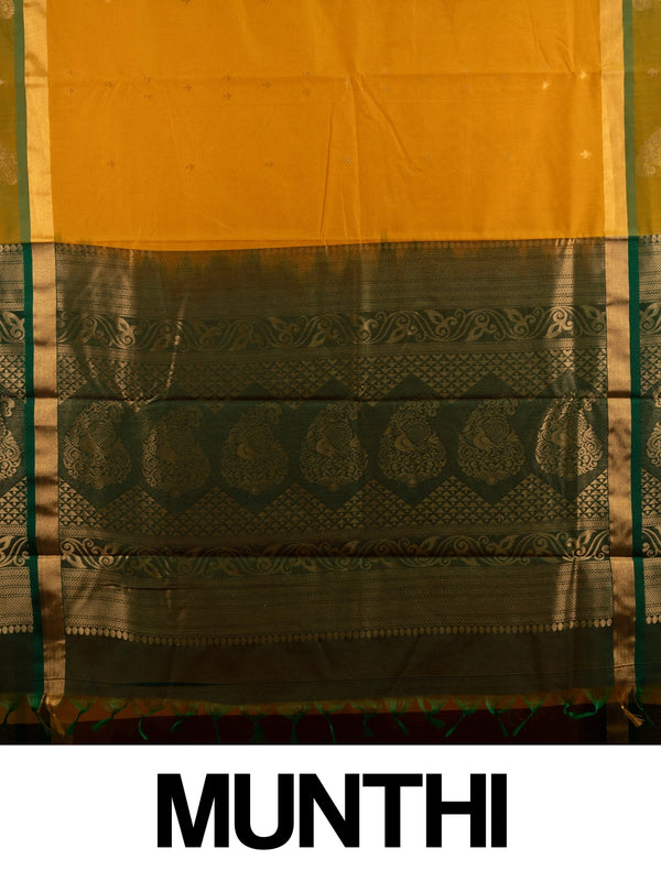Mustard yellow silk cotton saree with green gold zari border and peacock pallu