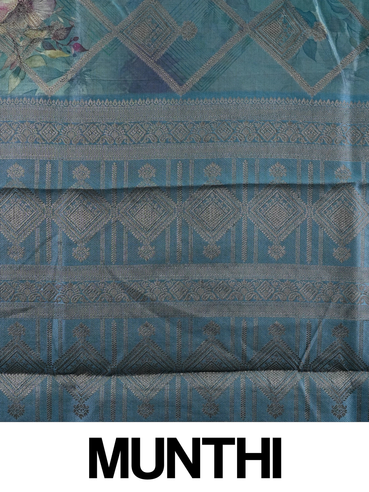 Teal blue semi tussar saree with floral print, diamond zari grid and contrast geometric border