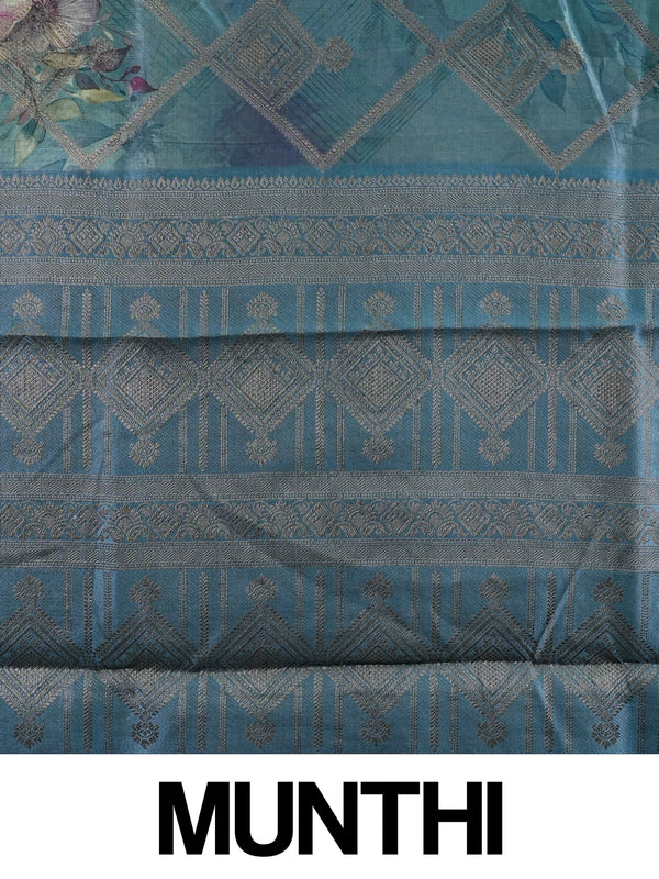 Teal blue semi tussar saree with floral print, diamond zari grid and contrast geometric border