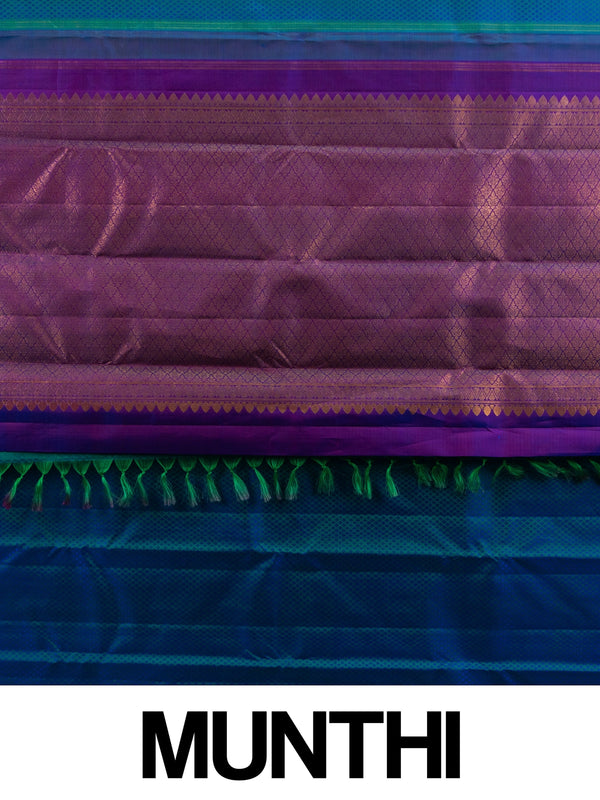Peacock blue pure Kanchipuram silk saree with contrast purple gold zari border and paisley buttas