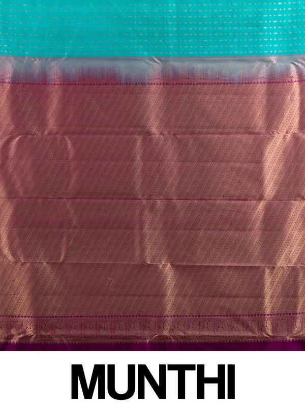 Teal pure Kanchipuram silk saree with gold zari butis and contrast magenta zari border and pallu