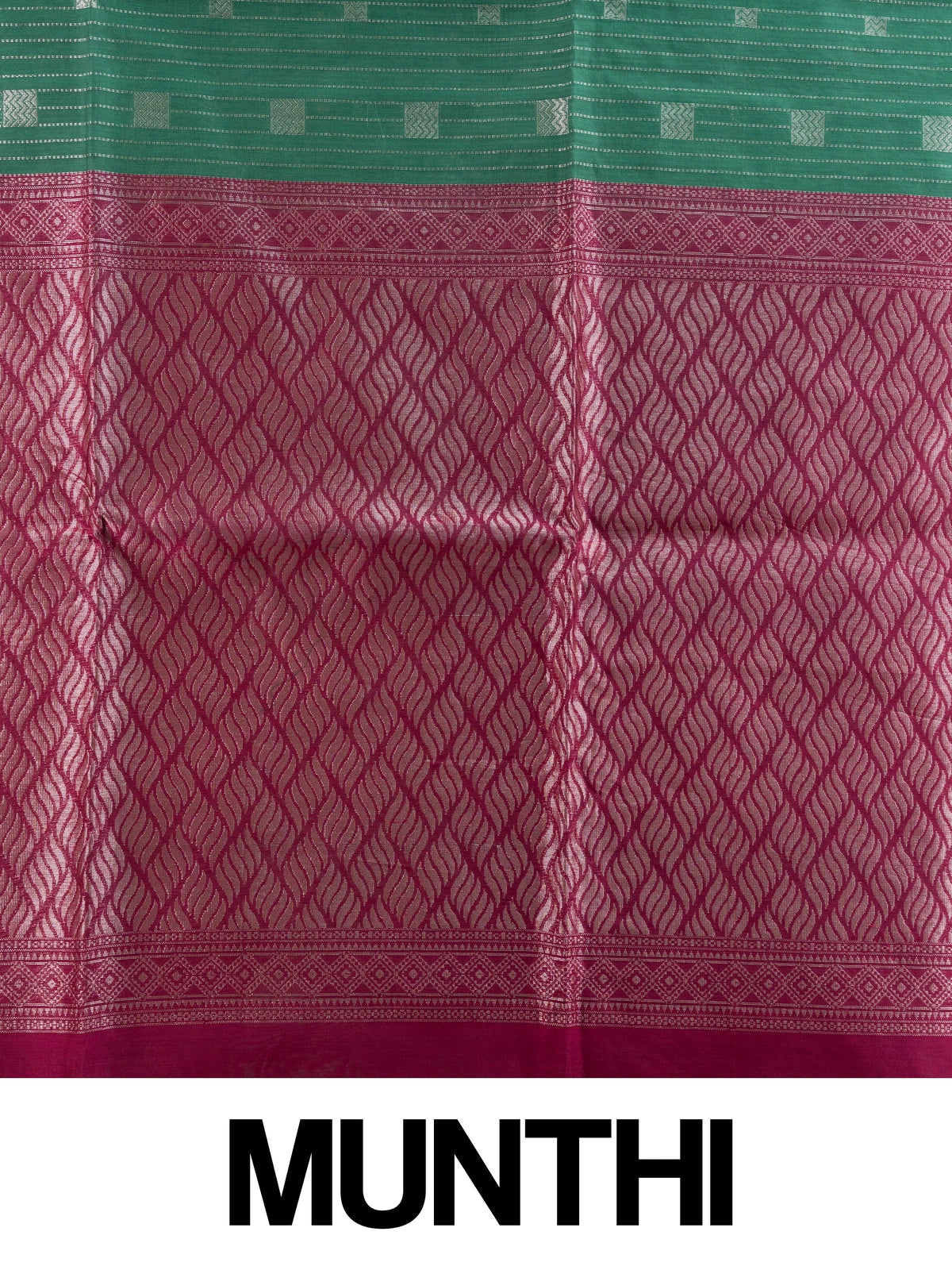 Green silk cotton saree with silver zari stripes and contrast magenta zari border and pallu
