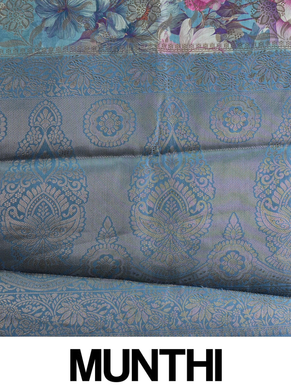 Teal blue semi tussar saree with pink floral print and contrast zari border