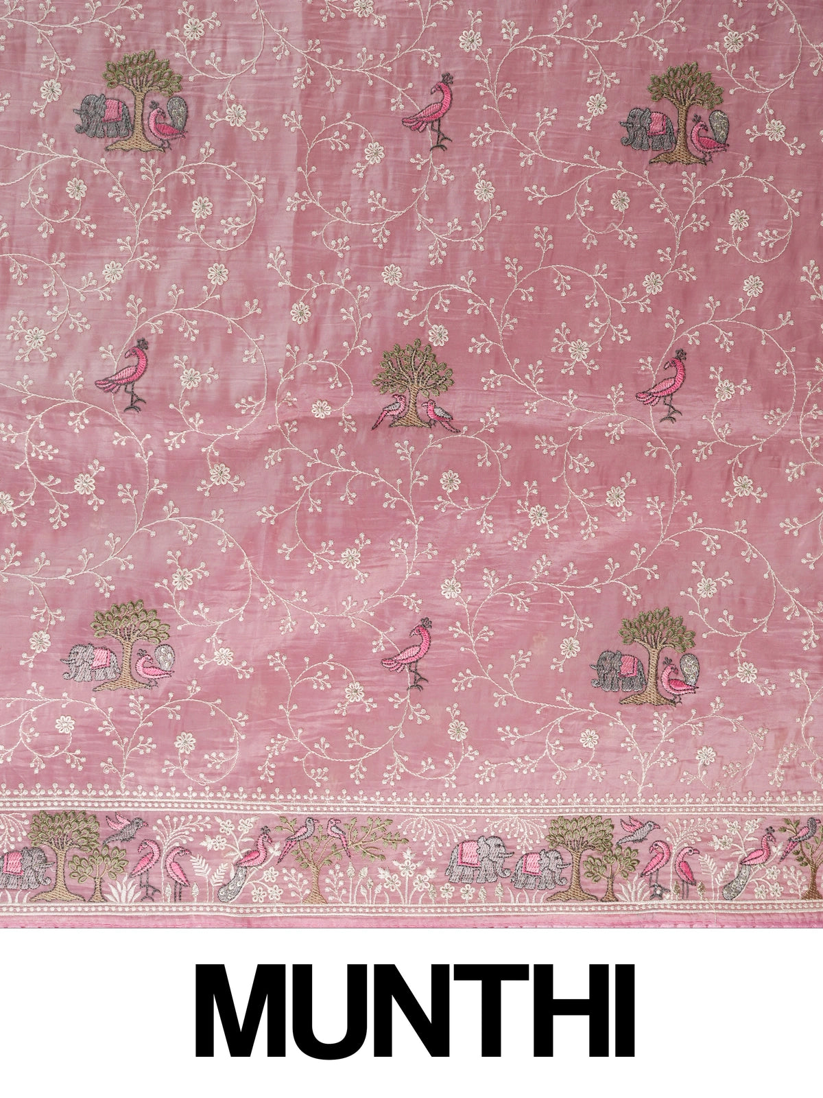 Pastel pink embroidered designer saree with floral jaal, bird and elephant motifs and pom-pom border