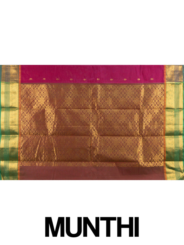 Pink Chettinad cotton saree with contrast green-and-gold zari border, gold buttas, and ornate gold pallu