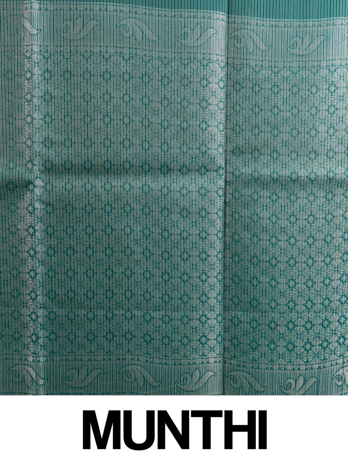 Teal green silk cotton saree with silver zari floral butta and ornate zari pallu