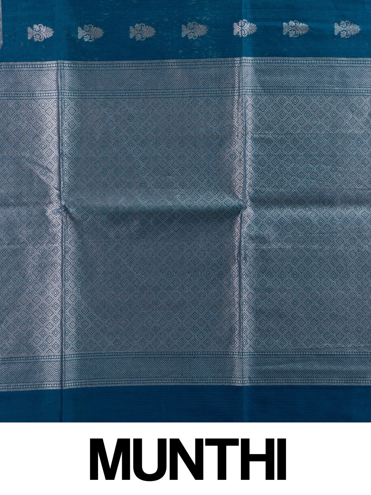 Peacock blue silk cotton saree with silver zari buttas and diamond-patterned zari border and pallu