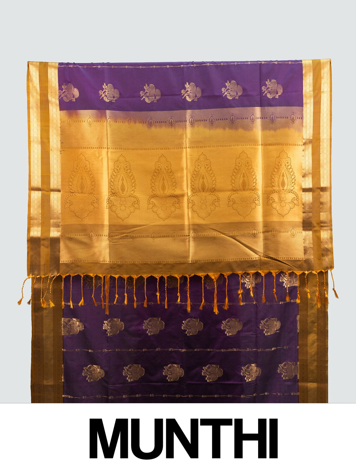 Purple Kanchipuram fancy silk saree with mustard-gold zari border, floral buttas and paisley pallu