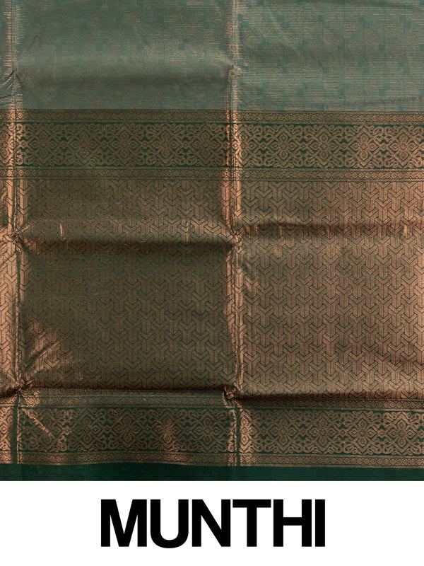 Dark green silk cotton saree with copper-gold zari border and geometric woven pallu