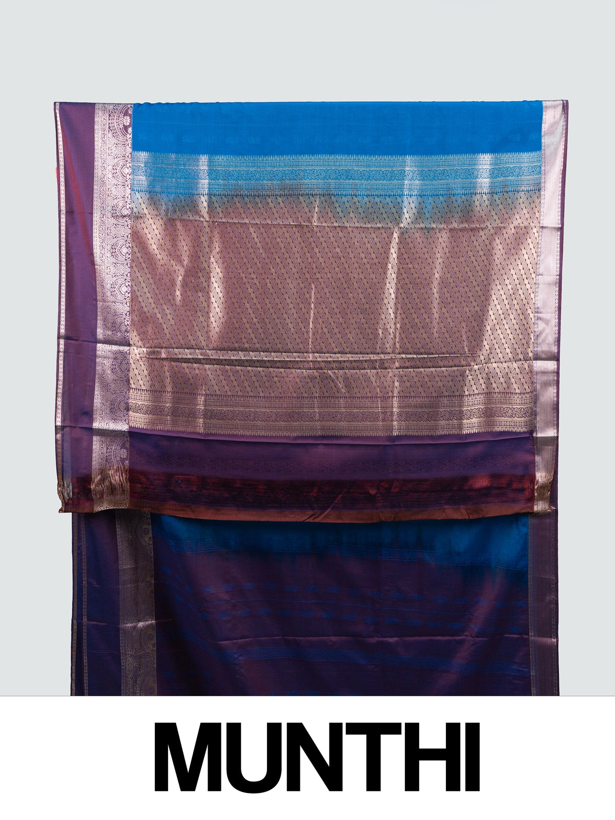 Peacock blue semi silk saree with contrast purple border and silver zari pallu