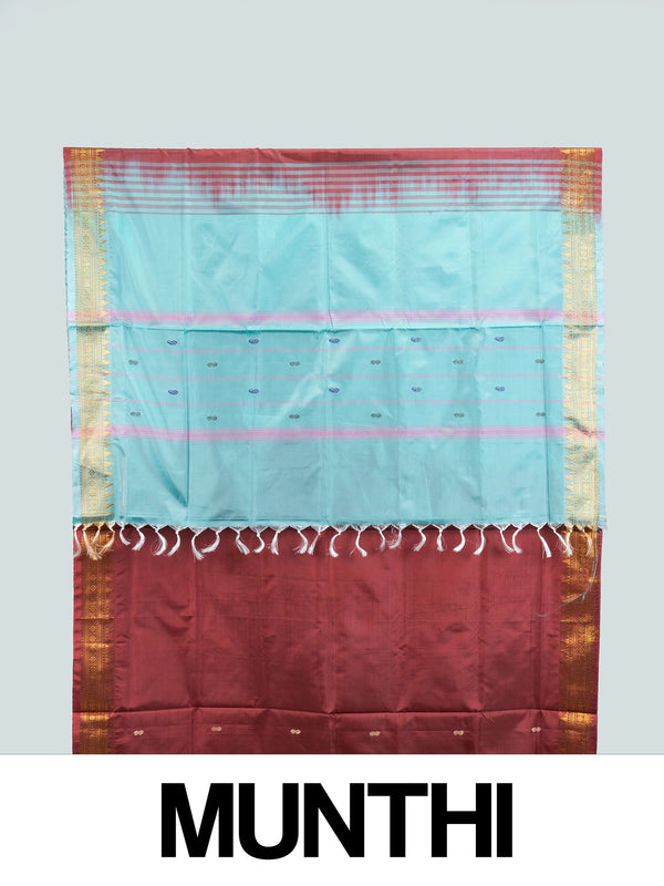 Maroon Banana Silk saree with turquoise contrast pallu and gold zari temple border