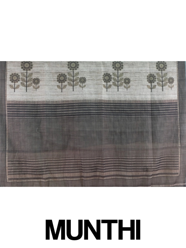 Beige linen cotton saree with grey floral prints and a contrast grey-black striped border