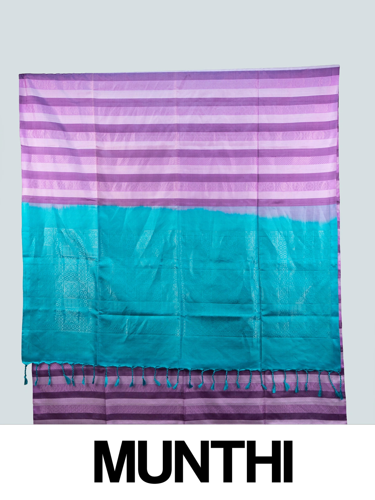 Purple striped soft silk saree with contrast teal pallu, gold zari buttis and tasselled edge