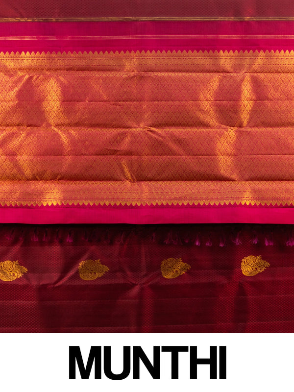 Maroon pure Kanchipuram silk saree with contrast pink and gold zari border and paisley buttas