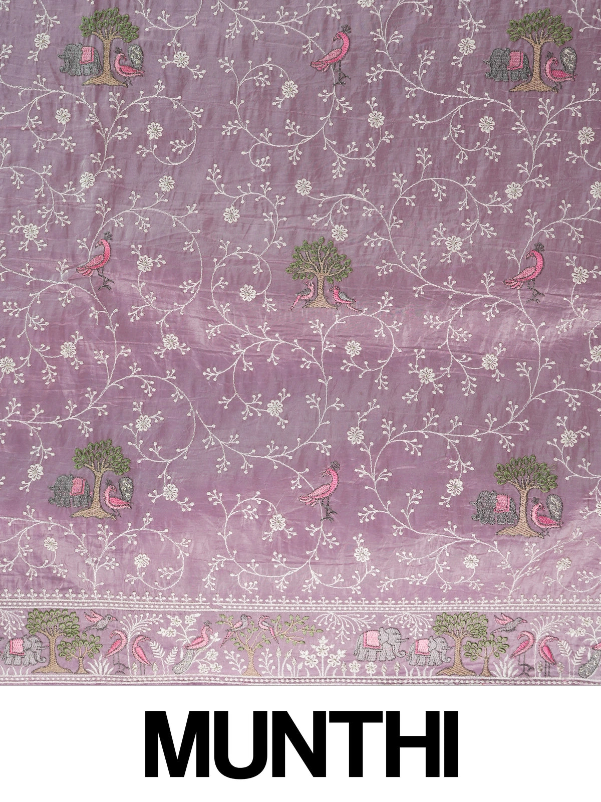 Lavender designer saree with white floral embroidery, bird and elephant motifs and pom-pom lace border