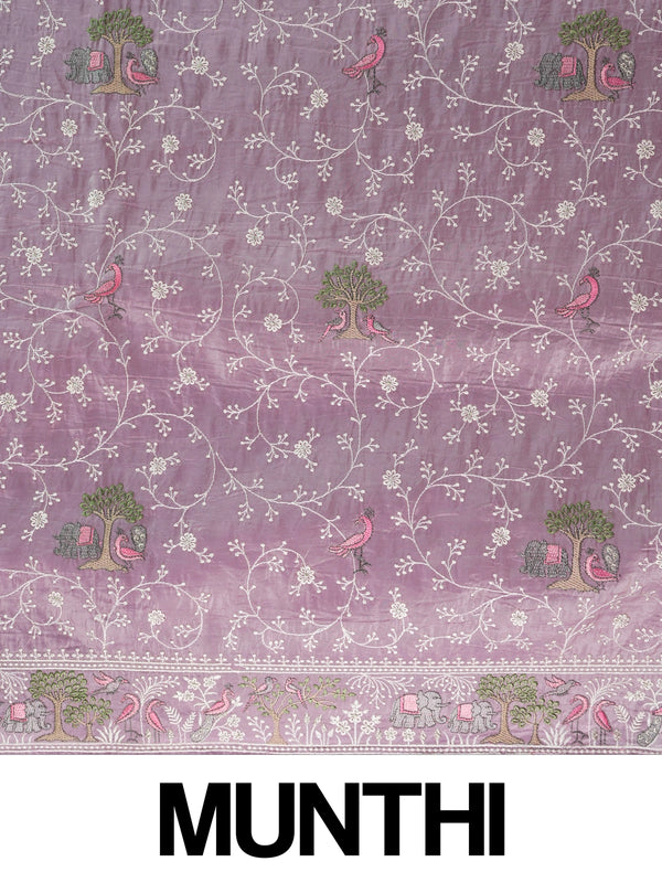 Lavender designer saree with white floral embroidery, bird and elephant motifs and pom-pom lace border