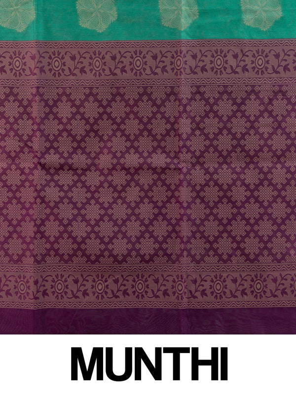 Teal green silk cotton saree with cream floral buttas and contrast purple woven border and pallu