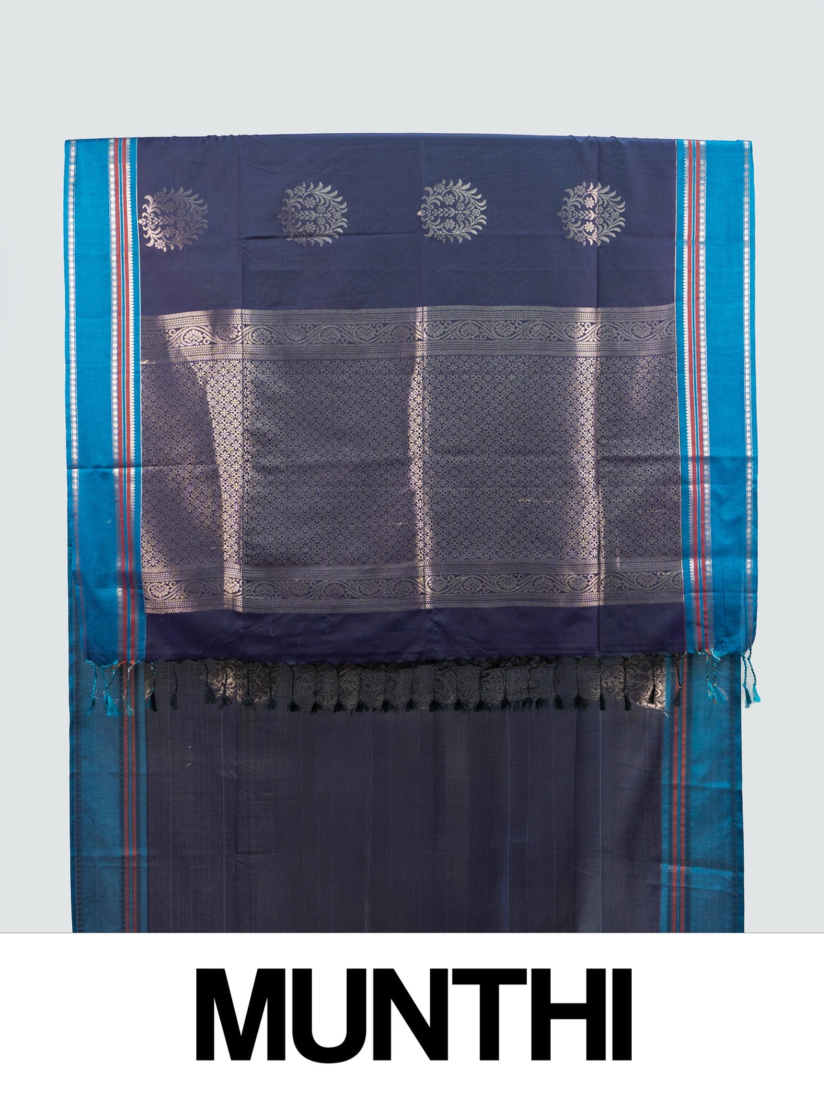 Navy blue Kanchipuram fancy silk saree with peacock blue contrast border and silver zari floral buttas