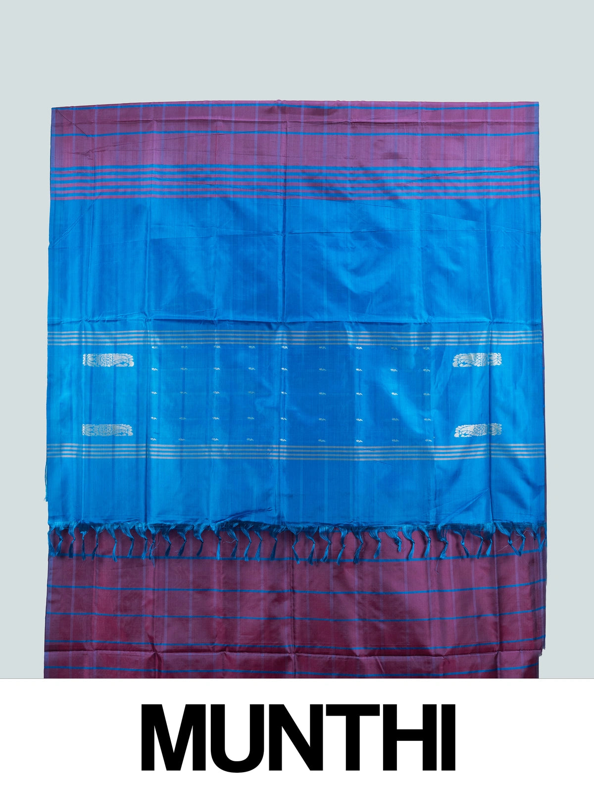 Purple and blue checked banana silk saree with contrast blue border and silver zari paisley pallu