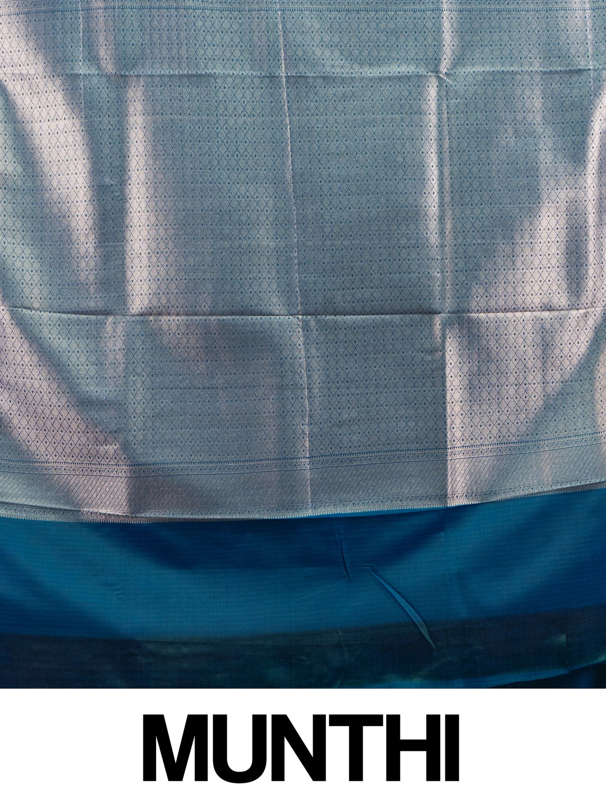 Lavender semi silk saree with teal blue contrast border and silver zari buttas